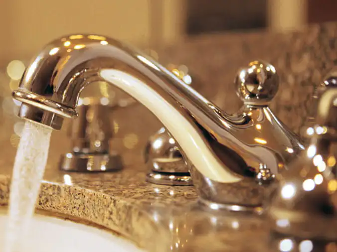 Closeup of bathroom sink faucet